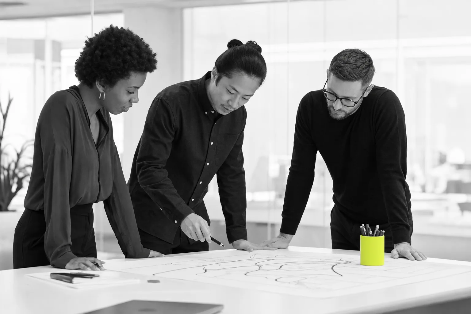 Operations and integration colleagues reviewing a process map
